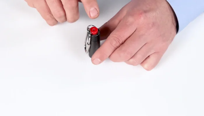 To send an emergency text without activating the siren, press the help button once.