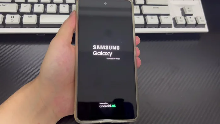 Release the buttons and wait for the phone to restart.